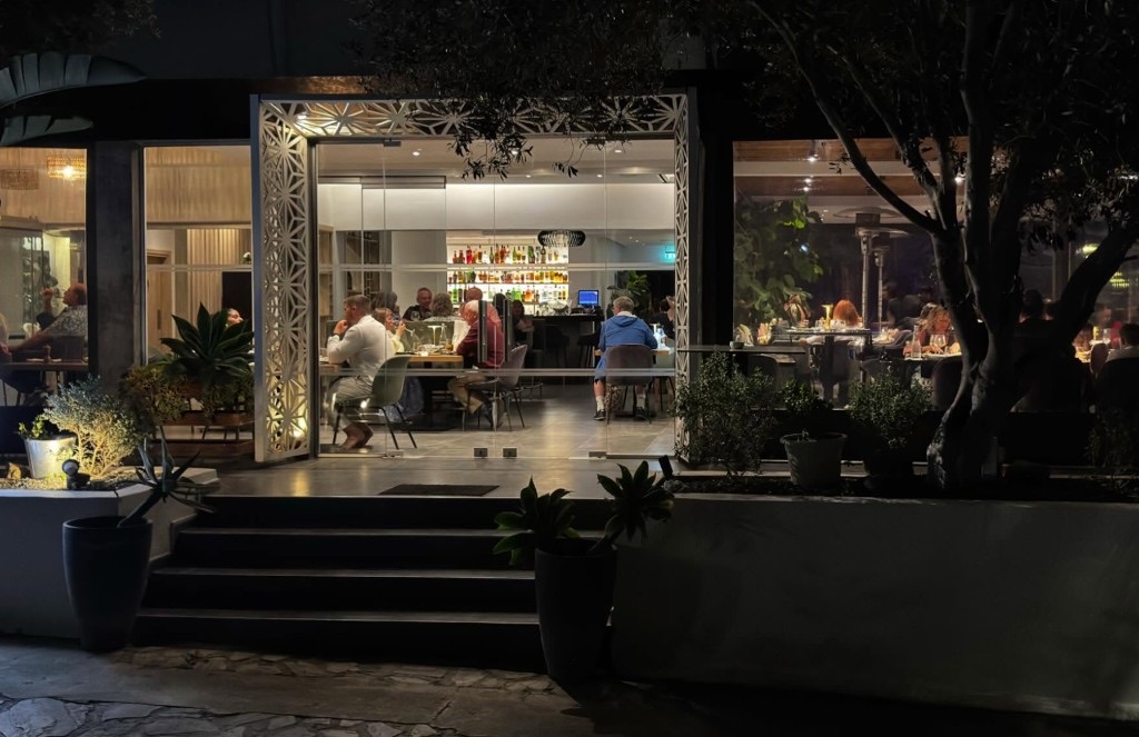 Ficardo Restaurant & Garden illuminated entrance at night in Paphos